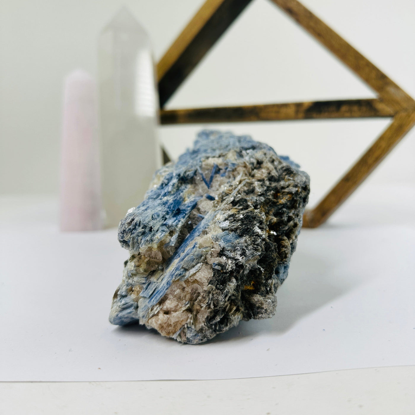 kyanite with decorations in the background