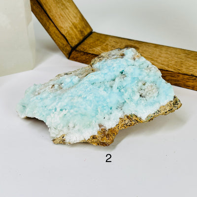 blue aragonite with decorations in the background