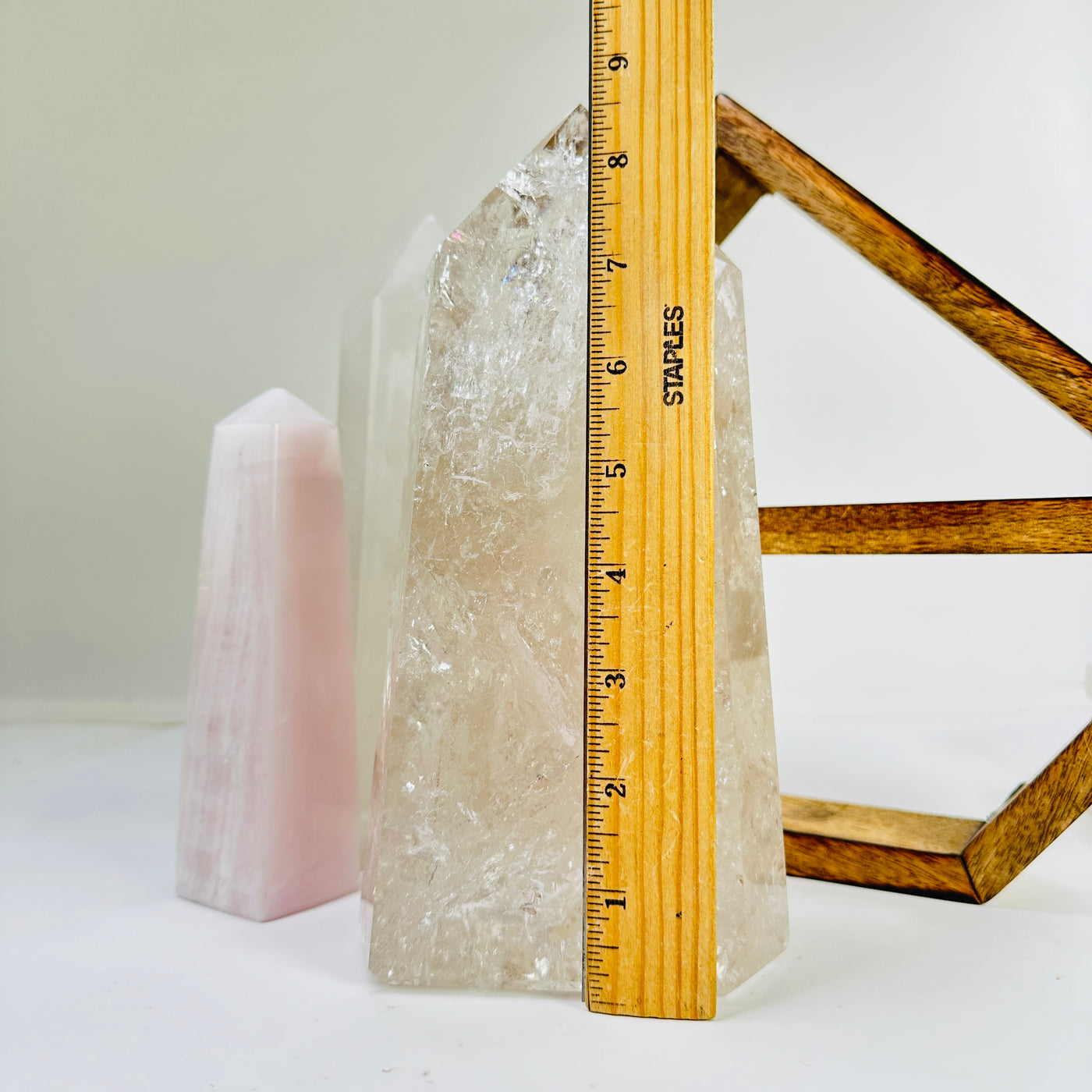 crystal quartz point next to a ruler for size reference