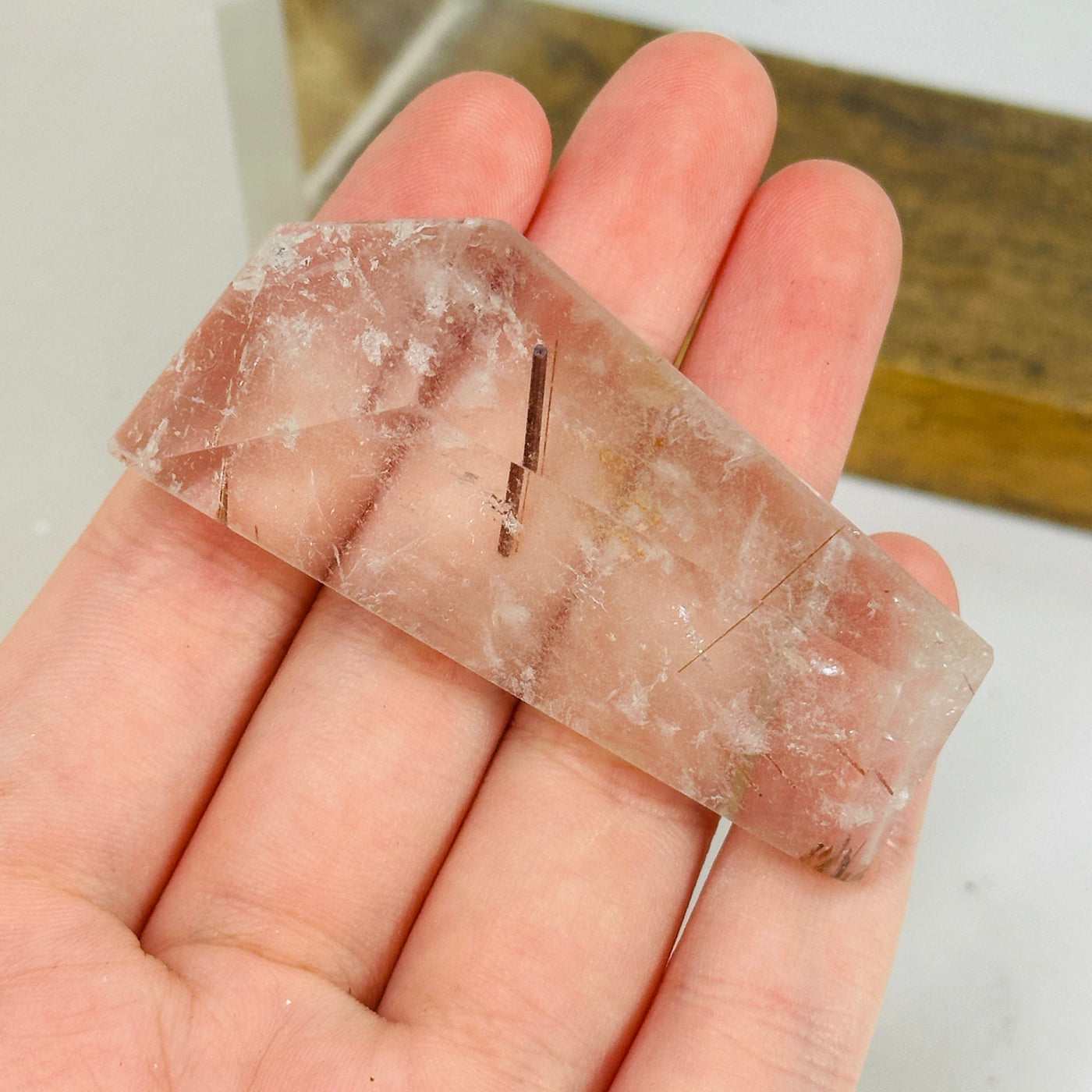 rutilated quartz with decorations in the background