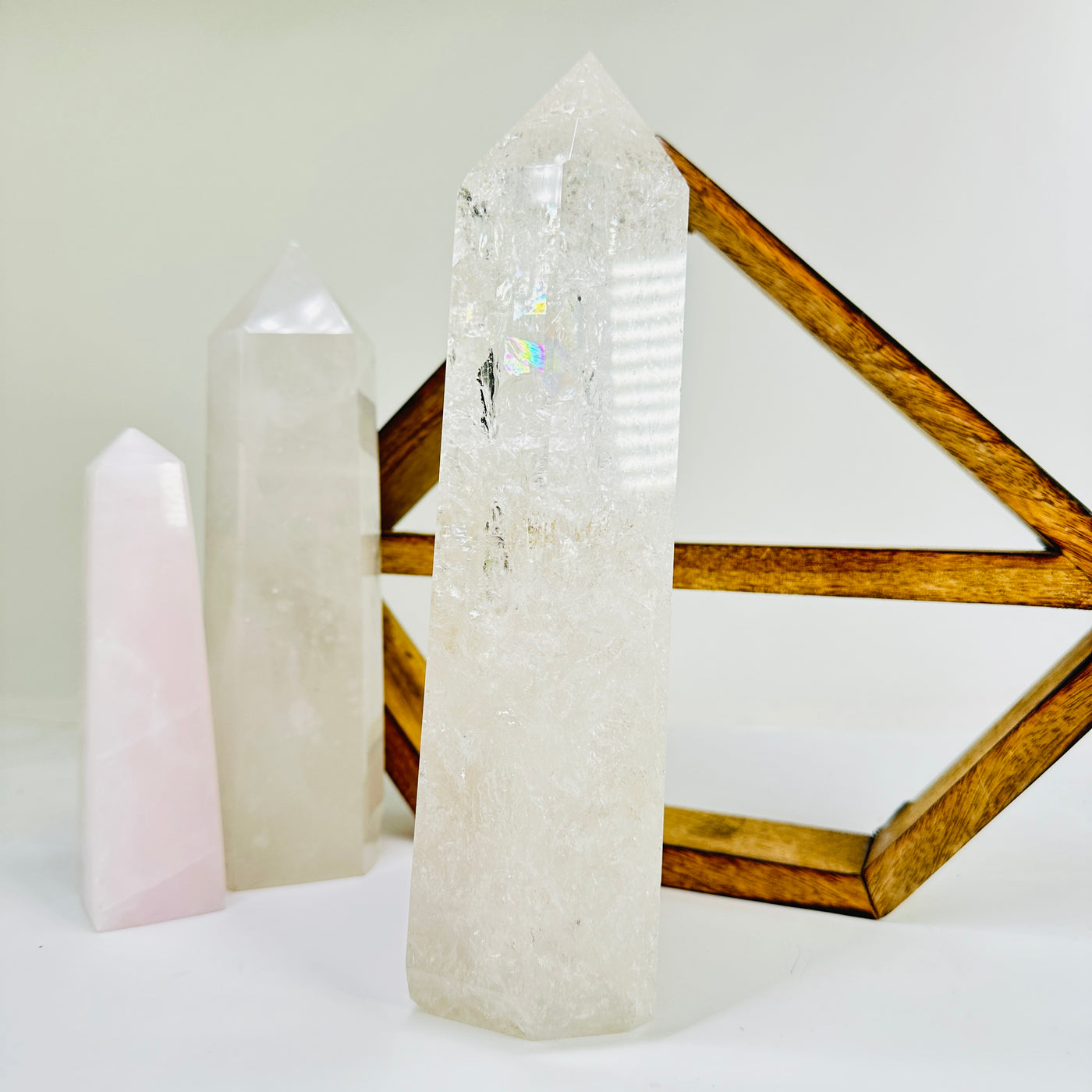 crystal quartz point with decorations in the background