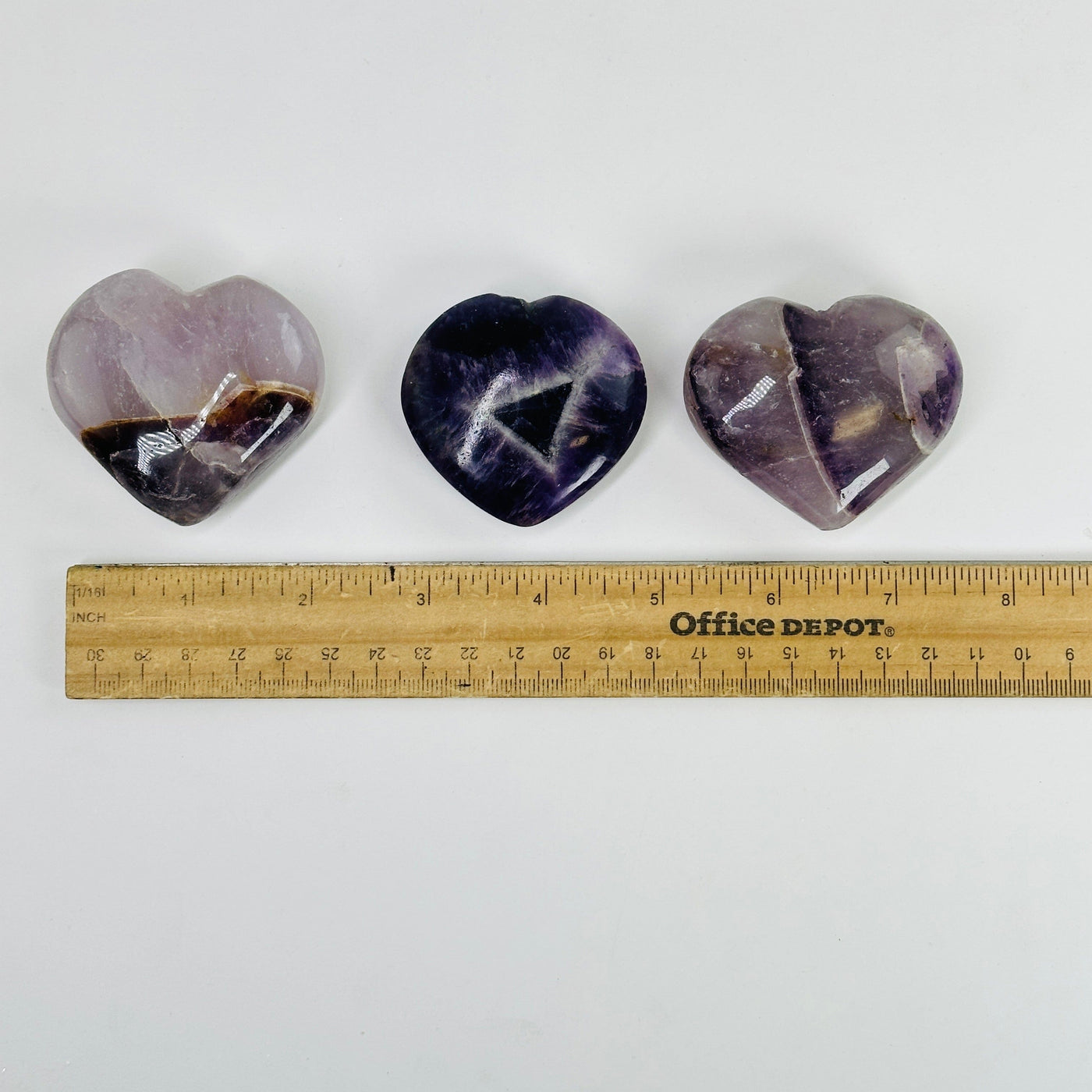 chevron amethyst hearts next to a ruler for size reference