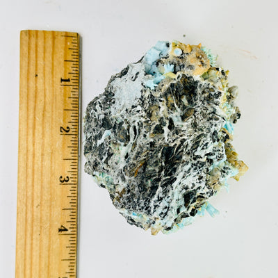 blue aragonite with decorations in the background