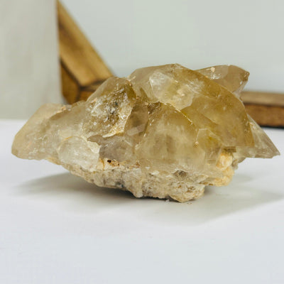 citrine cluster with decorations in the background