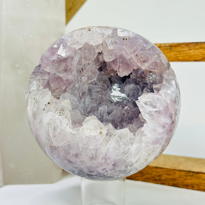 amethyst sphere with decorations in the background