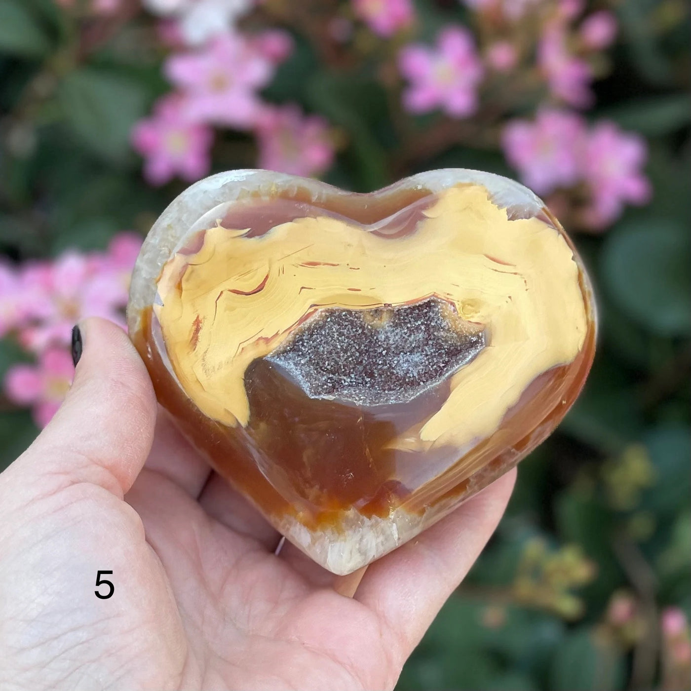 agate heart with decorations in the background