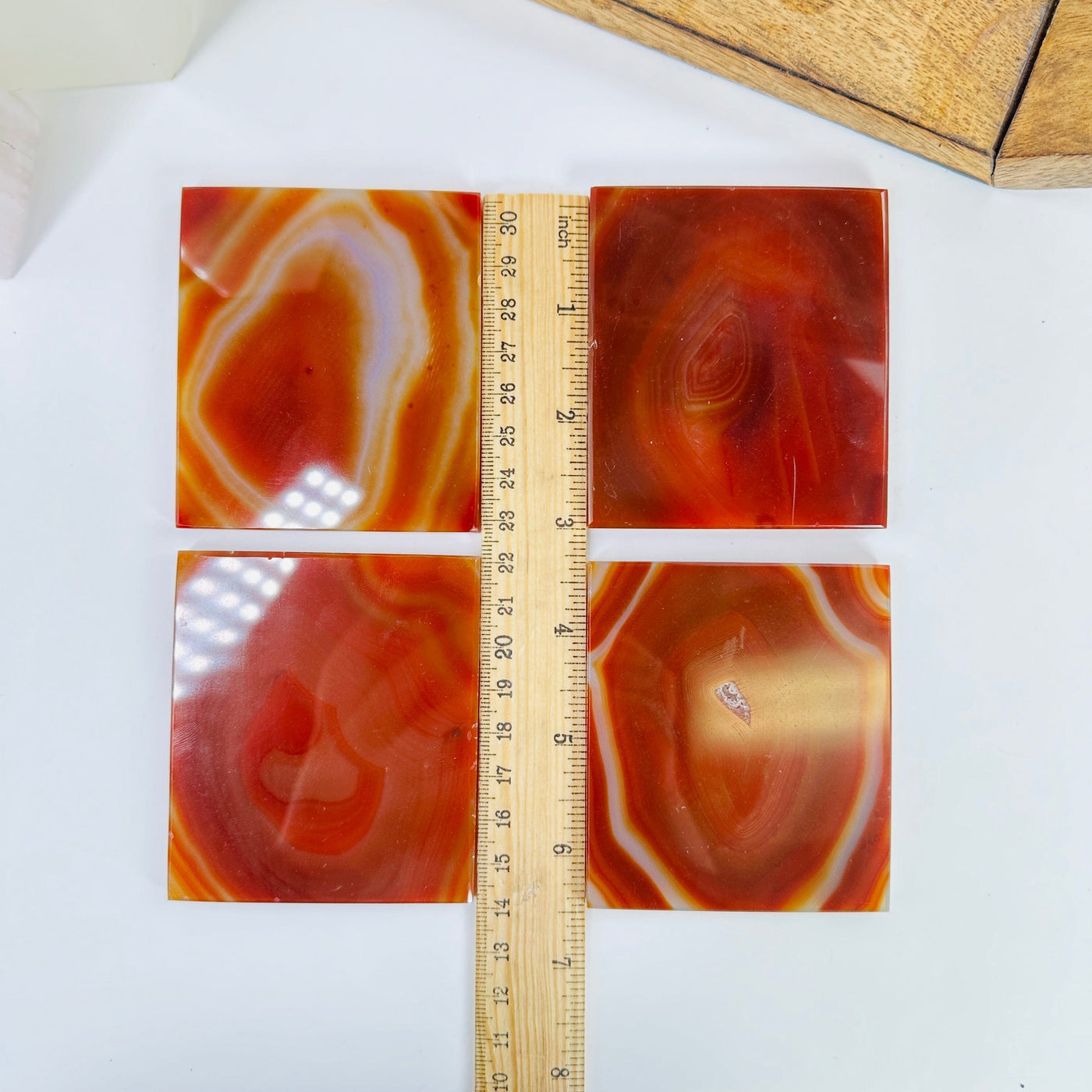 agate slices next to a ruler for size reference