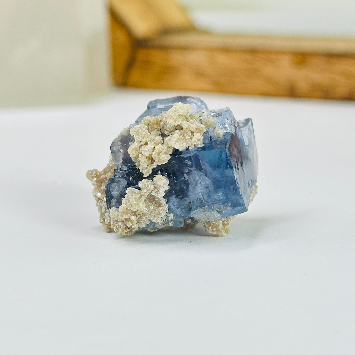 blue fluorite with decorations in the background