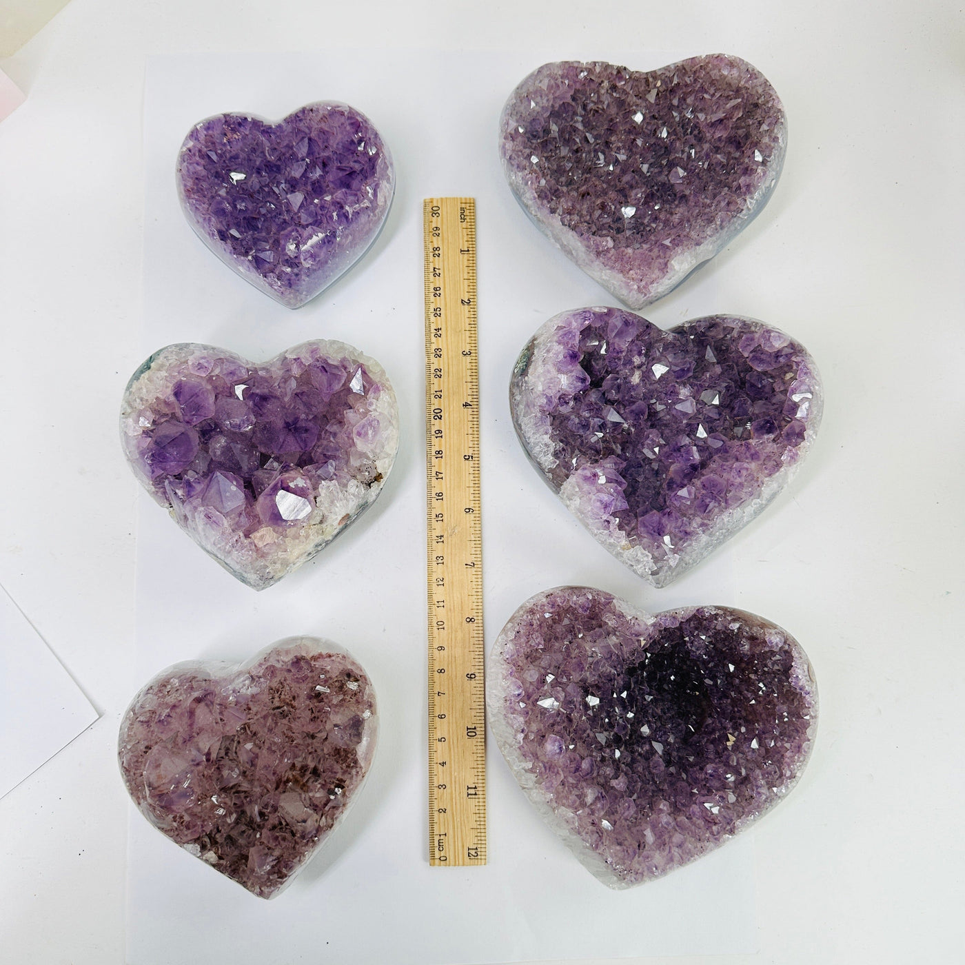 amethyst hearts next to a ruler for size reference