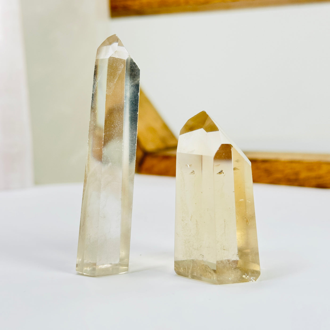 crystal quartz point with decorations in the background