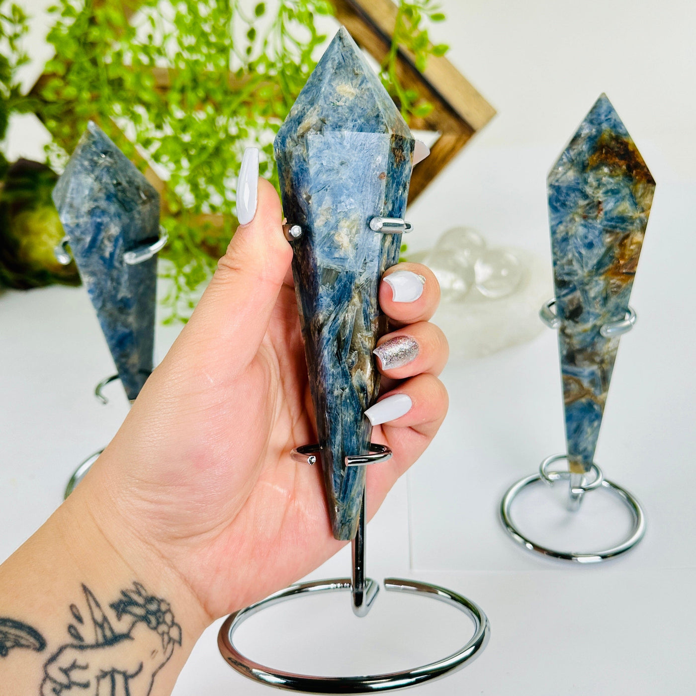 Blue Kyanite Crystal Wand on Stand - You Choose #3 variant 2 in hand for size reference with other variants in the background