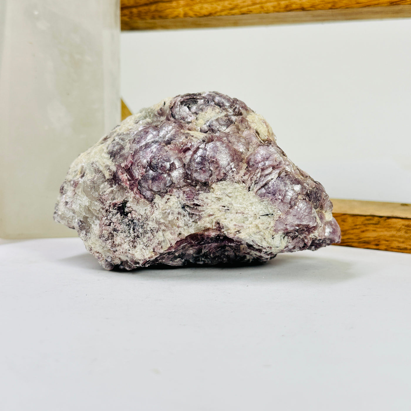 lepidolite with decorations in the background