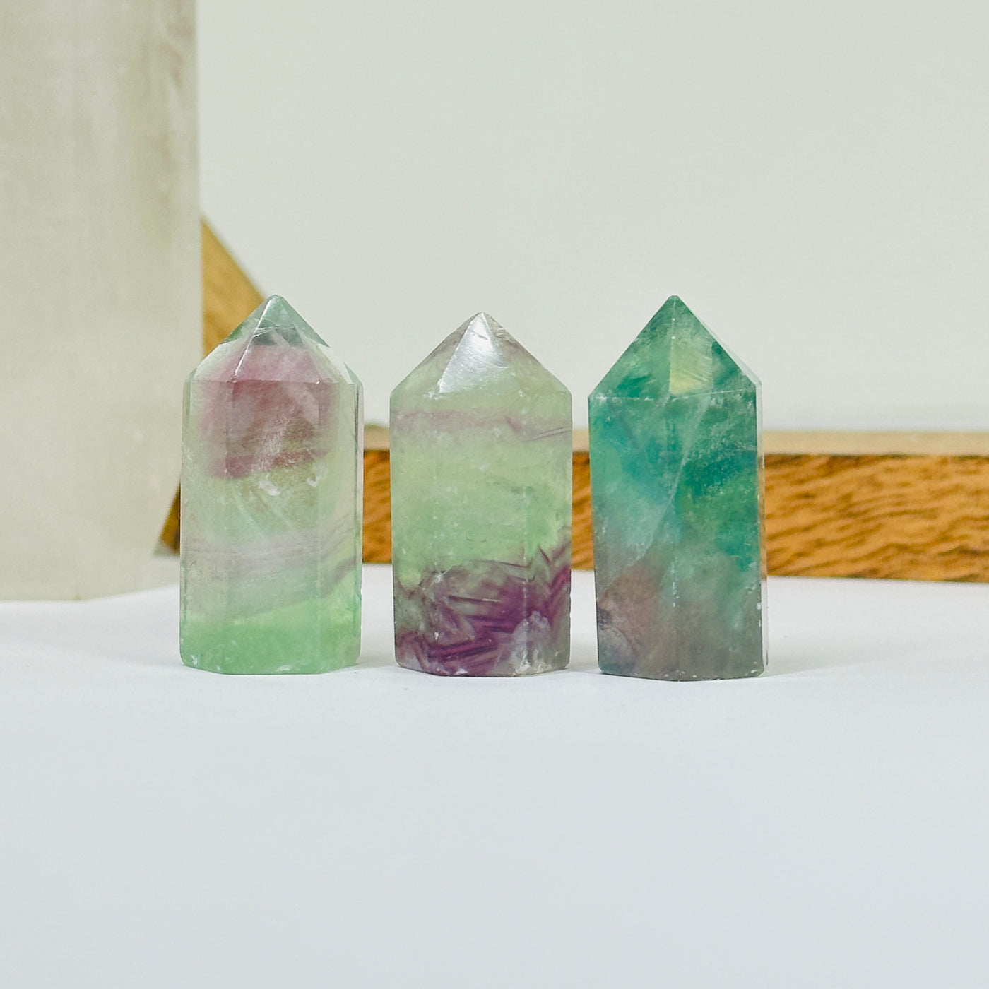 fluorite points with decorations in the background