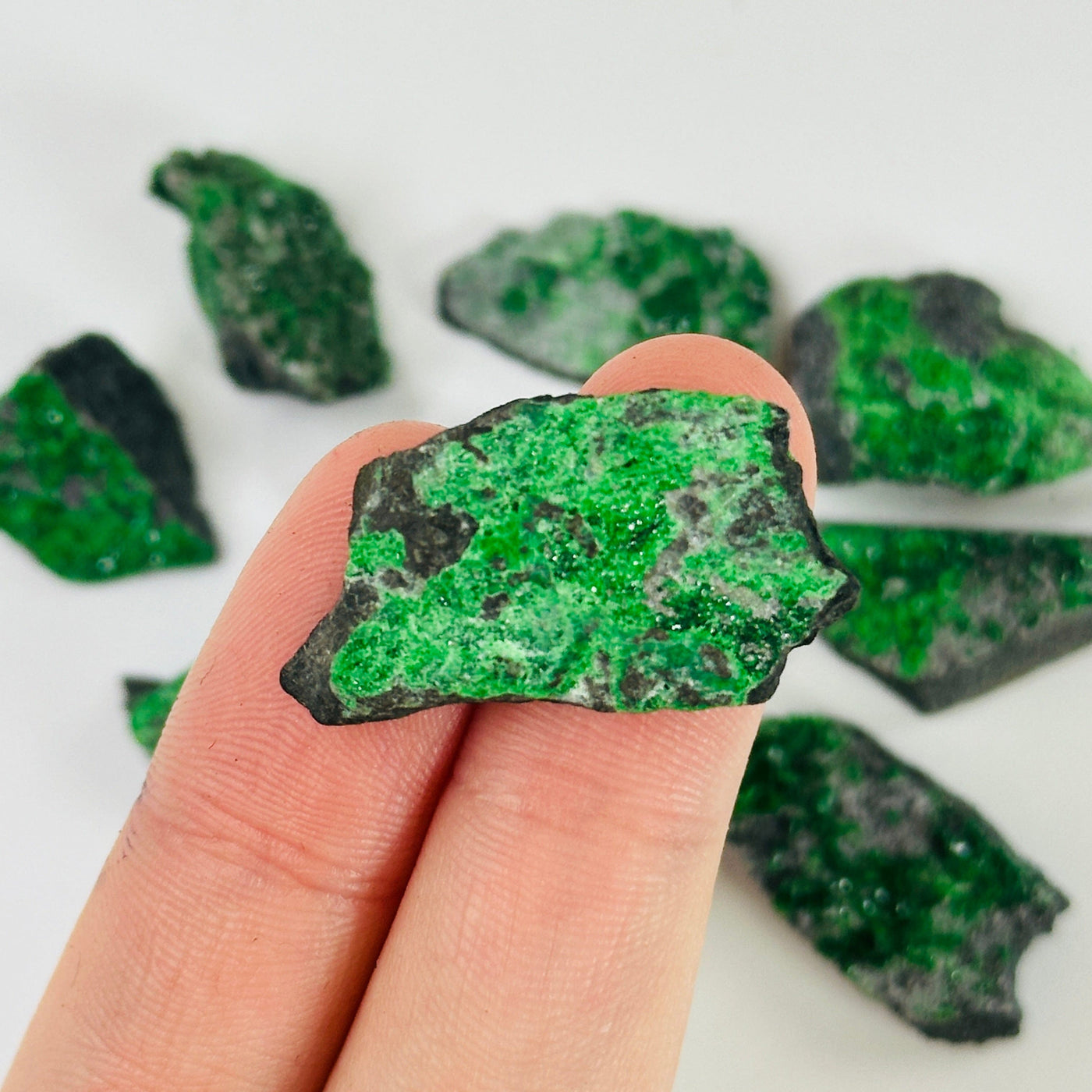 uvarovite pieces on white background