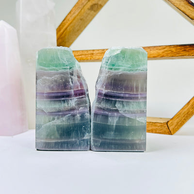 fluorite bookend with decorations in the background