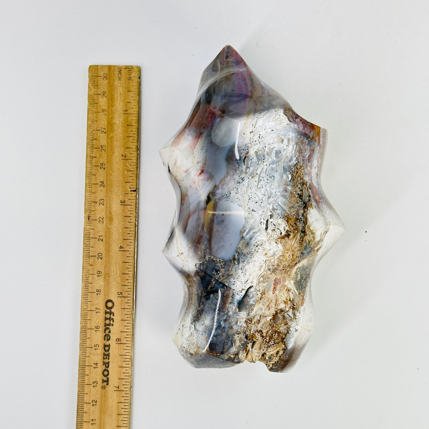 ocean jasper flame point next to a ruler for size reference