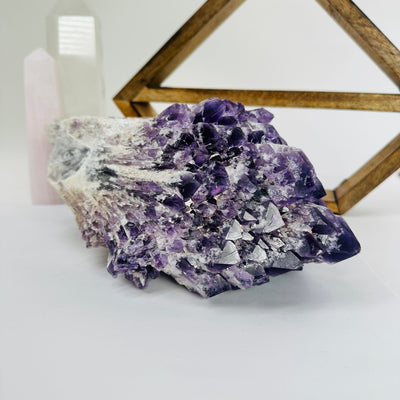 elestial amethyst with decorations in the background