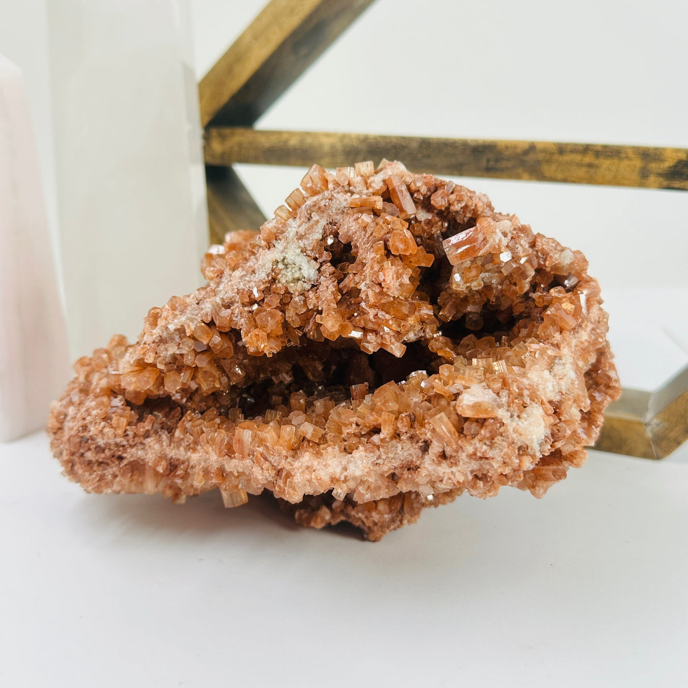 aragonite cluster with decorations in the background