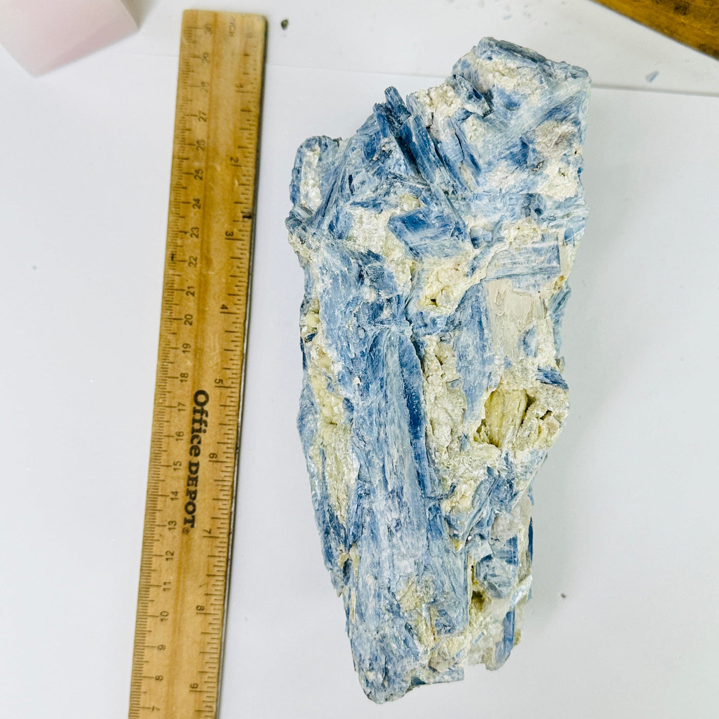 kyanite next to a ruler for size reference