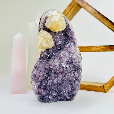 amethyst cut base with decorations in the background