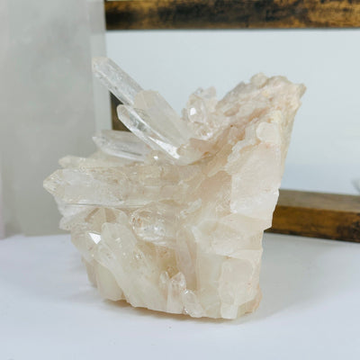 lemurian tangerine quartz with decorations in the background