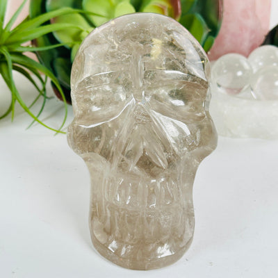 Crystal Quartz Skull Sculpture - As Is face view with closeup of chip on nose