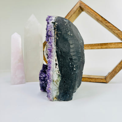 amethyst cut base with decorations in the background