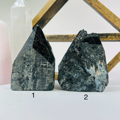 tourmaline points with decorations in the background