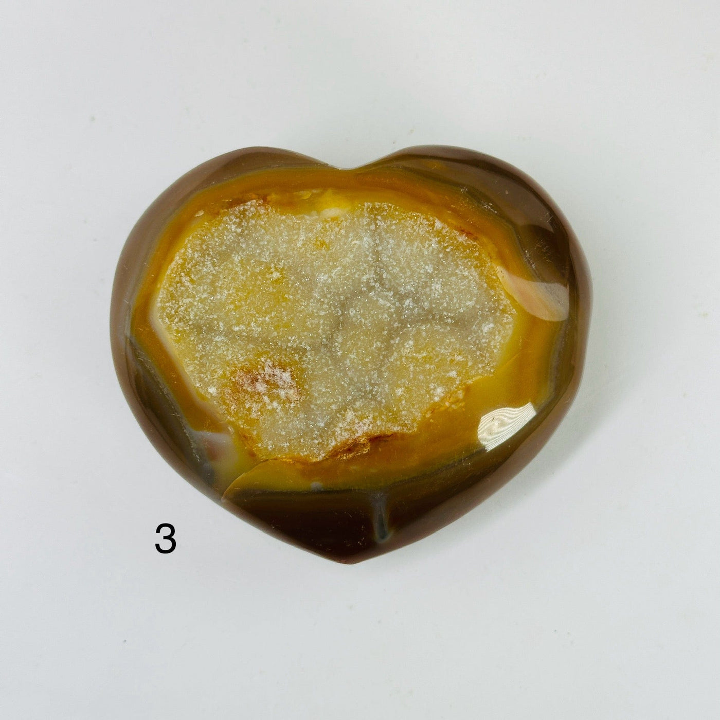 agate heart with decorations in the background