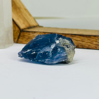 blue fluorite with decorations in the background