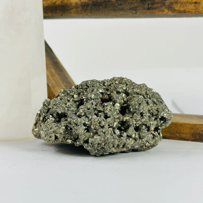 pyrite cluster with decorations in the background