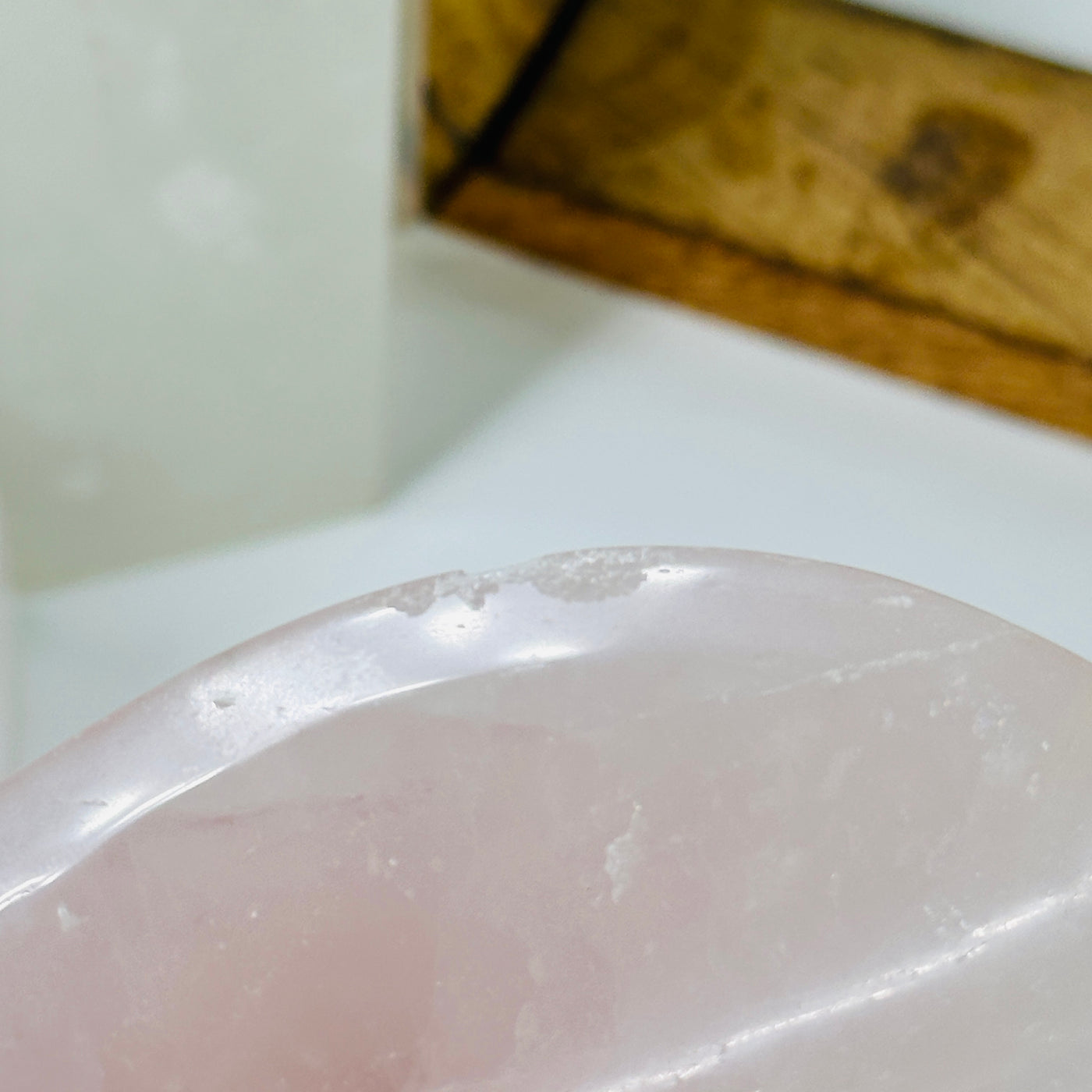 rose quartz bowl with decorations in the background