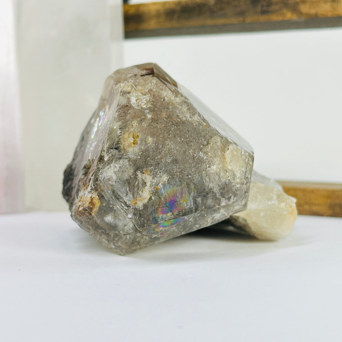 elestial smokey quartz with decorations in the background