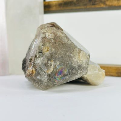 elestial smokey quartz with decorations in the background