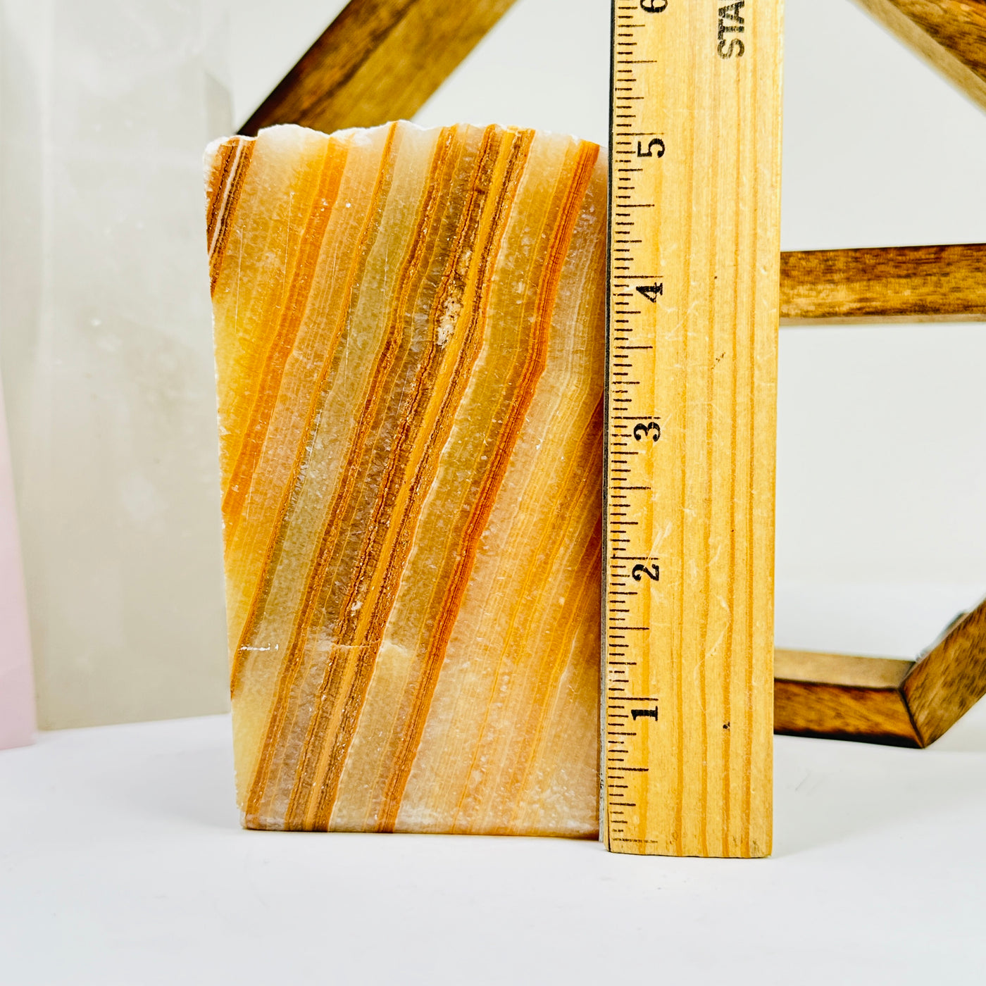 calcite cut base next to a ruler for size reference