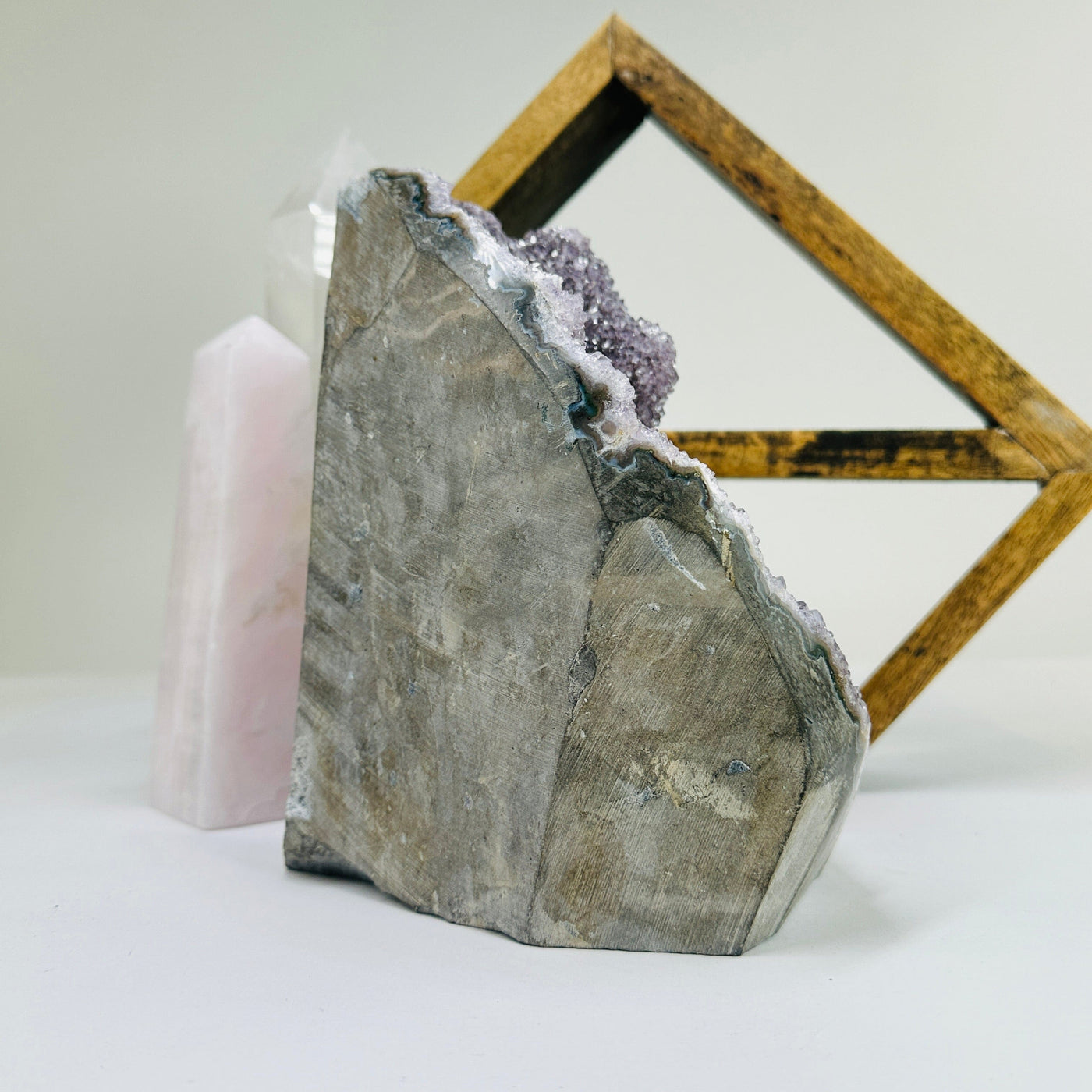 amethyst cut base with decorations in the background