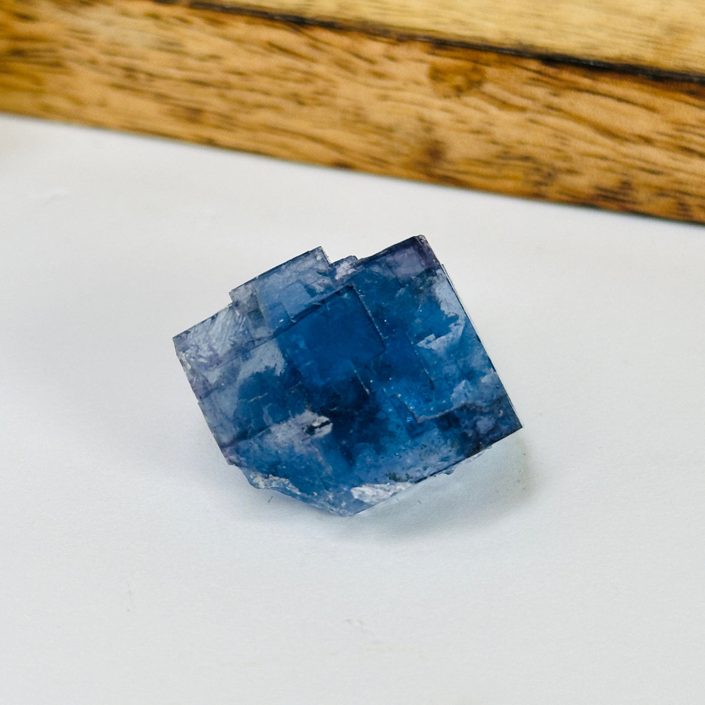 blue fluorite with decorations in the background