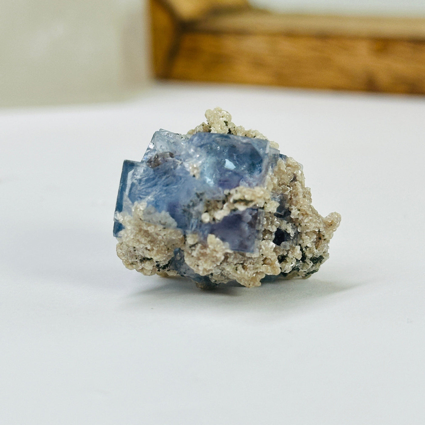 blue fluorite with decorations in the background