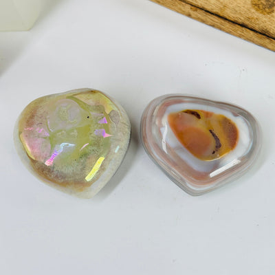 angel aura agate heart with decorations in the background