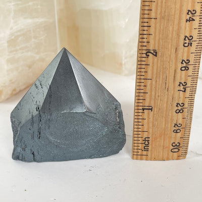  Hematite Semi Polished Crystal Point with a ruler for size reference