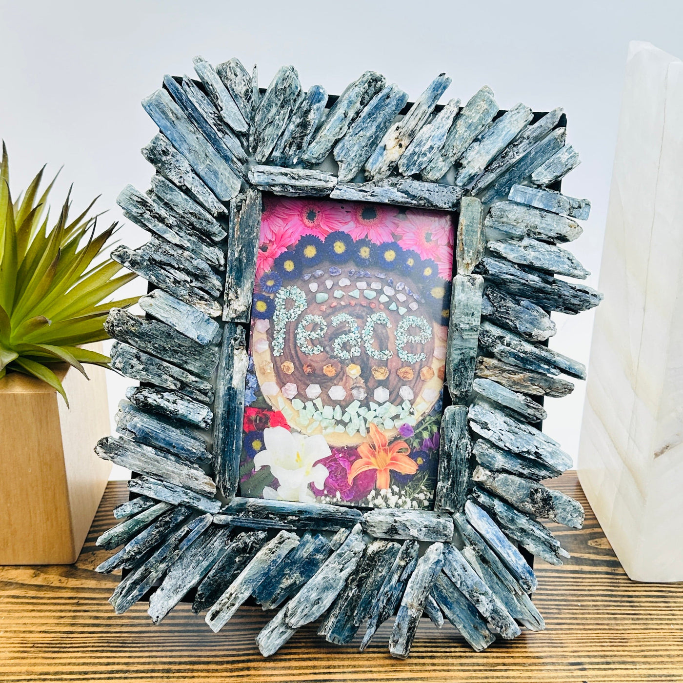 Blue Kyanite Crystal Picture Frame - One-of-a-Kind front view with props and plants