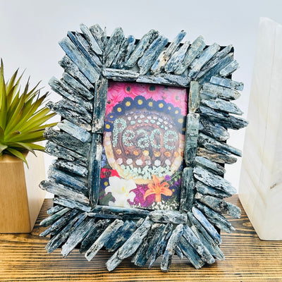 Blue Kyanite Crystal Picture Frame - One-of-a-Kind front view with props and plants