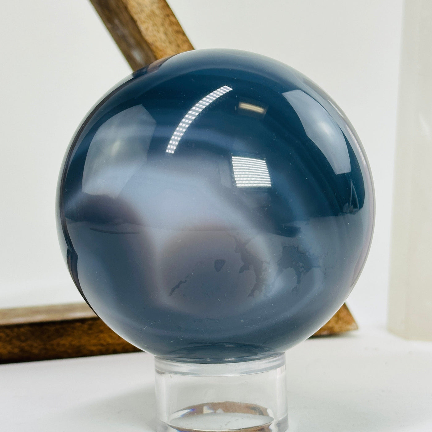 agate sphere with decorations in the background