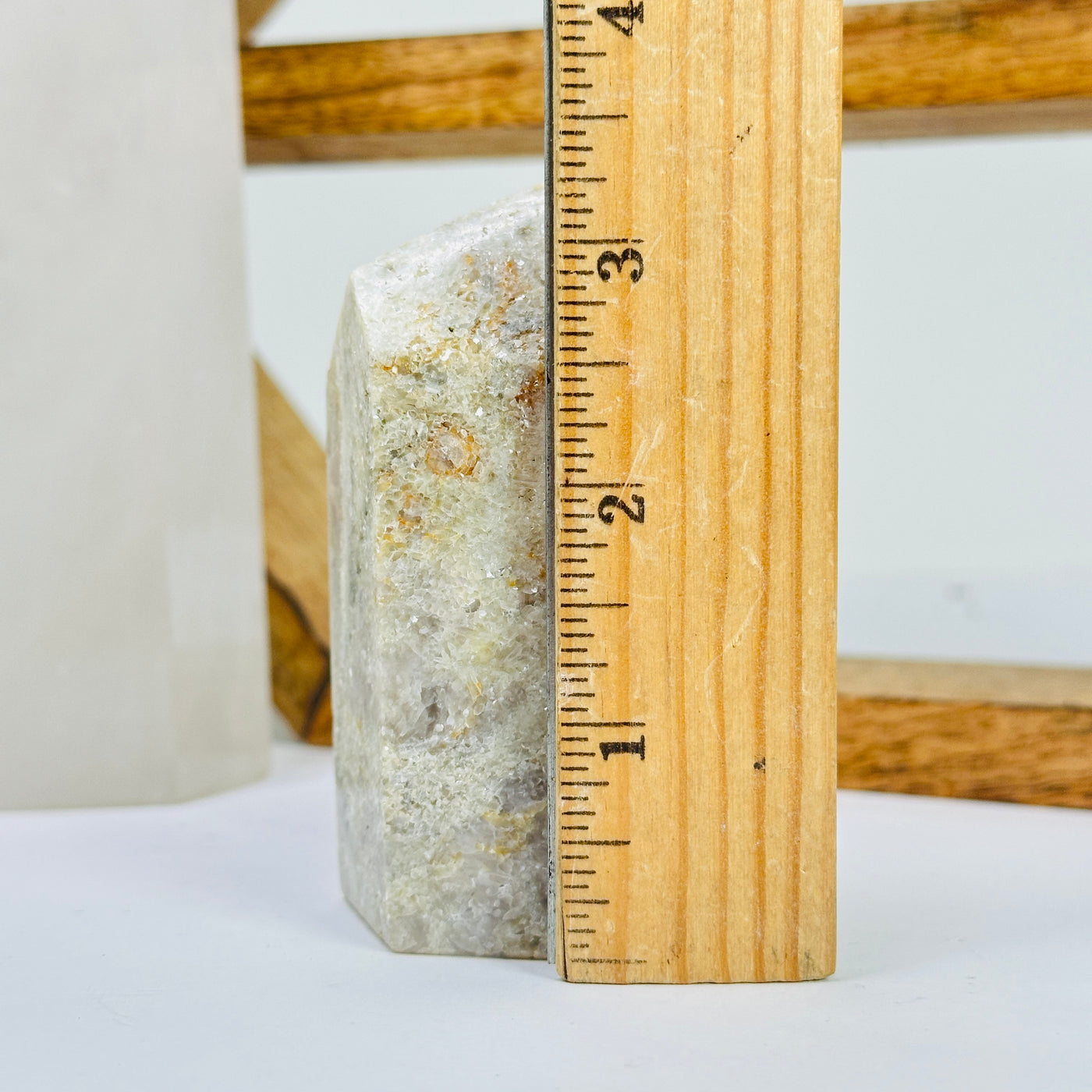 tourmaline point next to a ruler for size reference