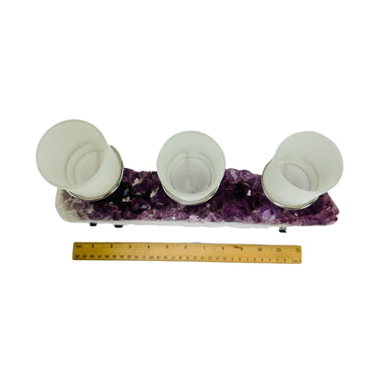 amethyst candle holder next to a ruler for size reference