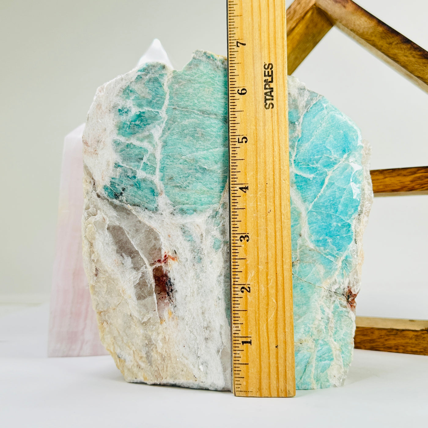 amazonite cut base next to a ruler for size reference