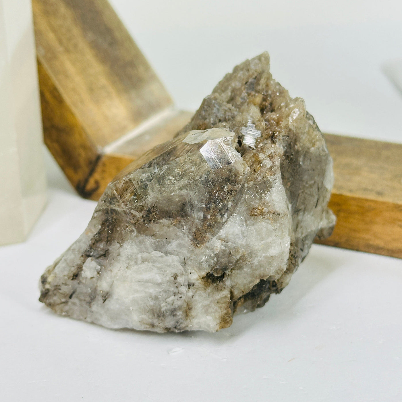 rutile quartz with decorations in the background