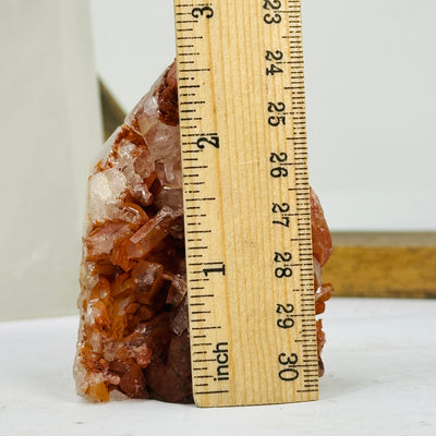 tangerine quartz points next to a ruler for size reference