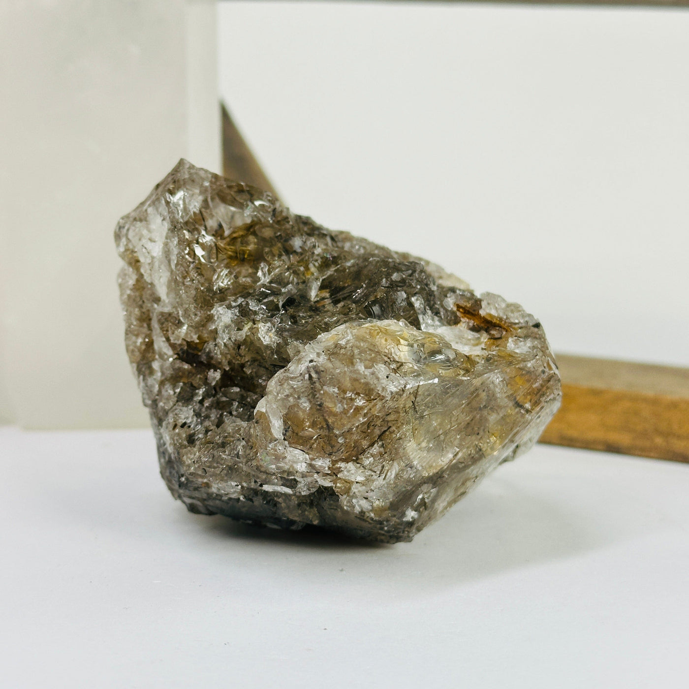 rutile quartz with decorations in the background