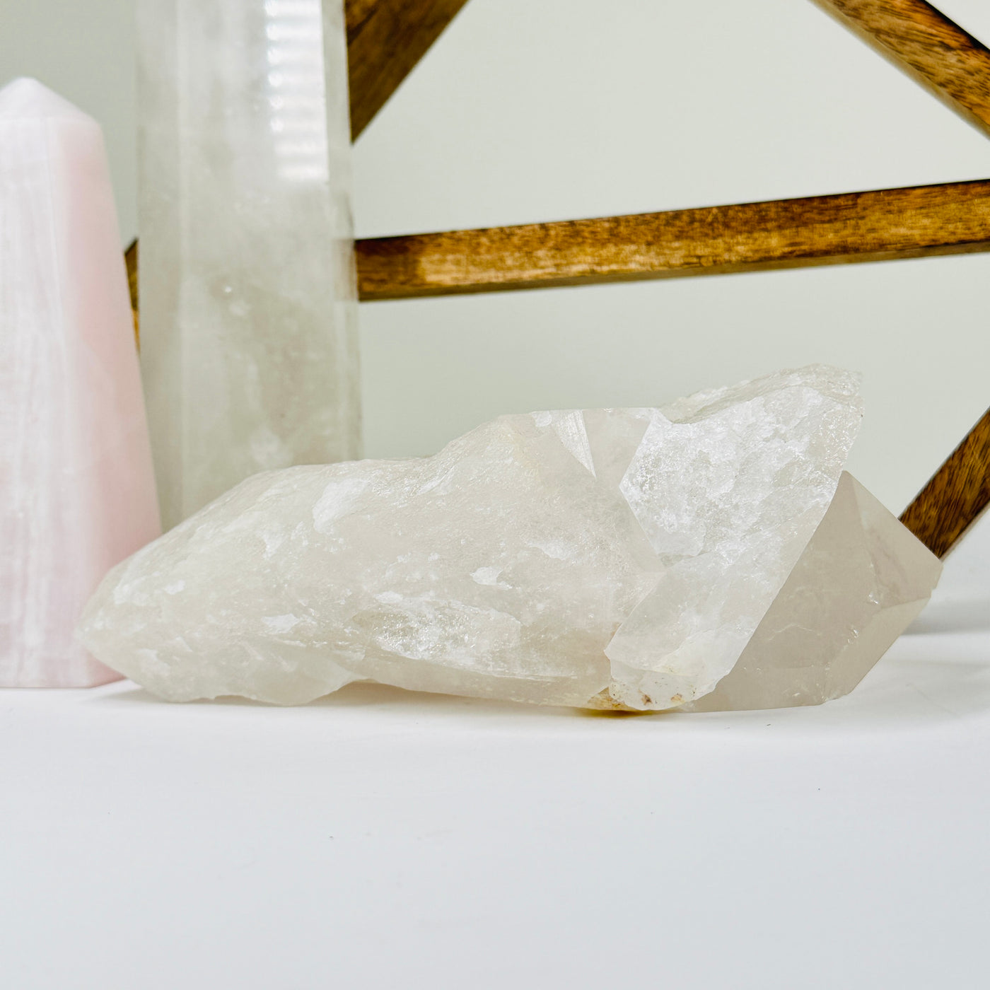 crystal quartz with decorations in  the background